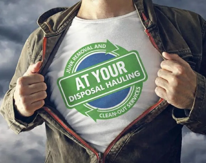 Man wearing tee shirt with company logo in the center.