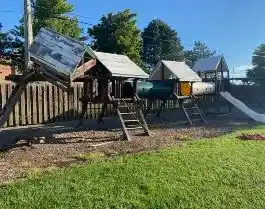 Large wooden playset being demolished by junk removal company in Columbus, Ohio.
